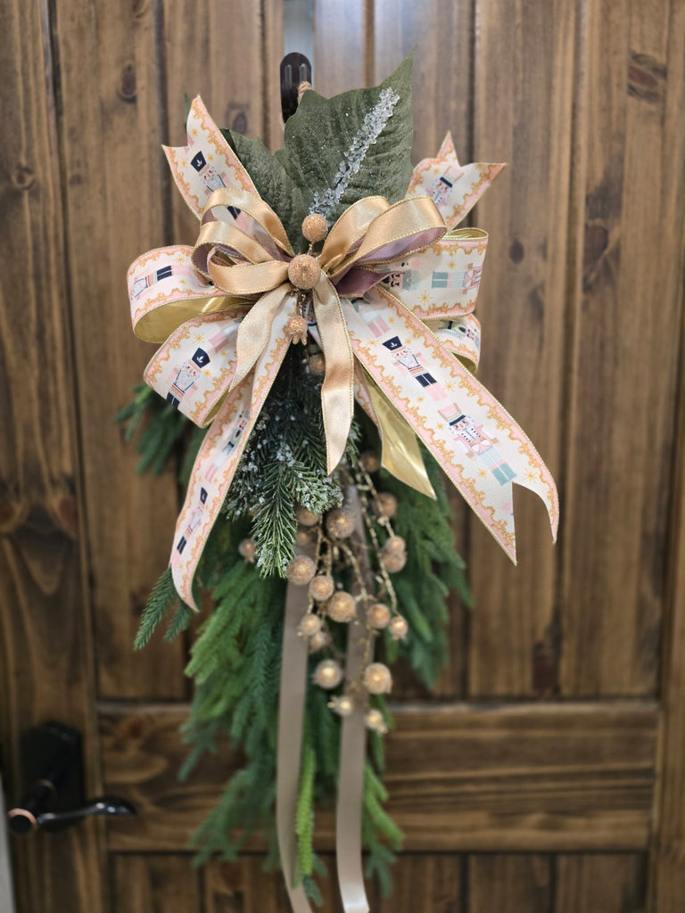 Handcrafted Christmas door swag with gold berries and Nutcracker ribbon bow