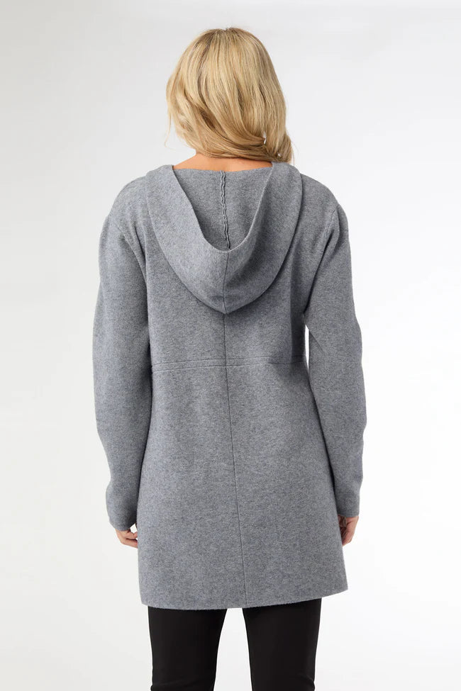 Person wearing a gray hooded cardigan on a white background