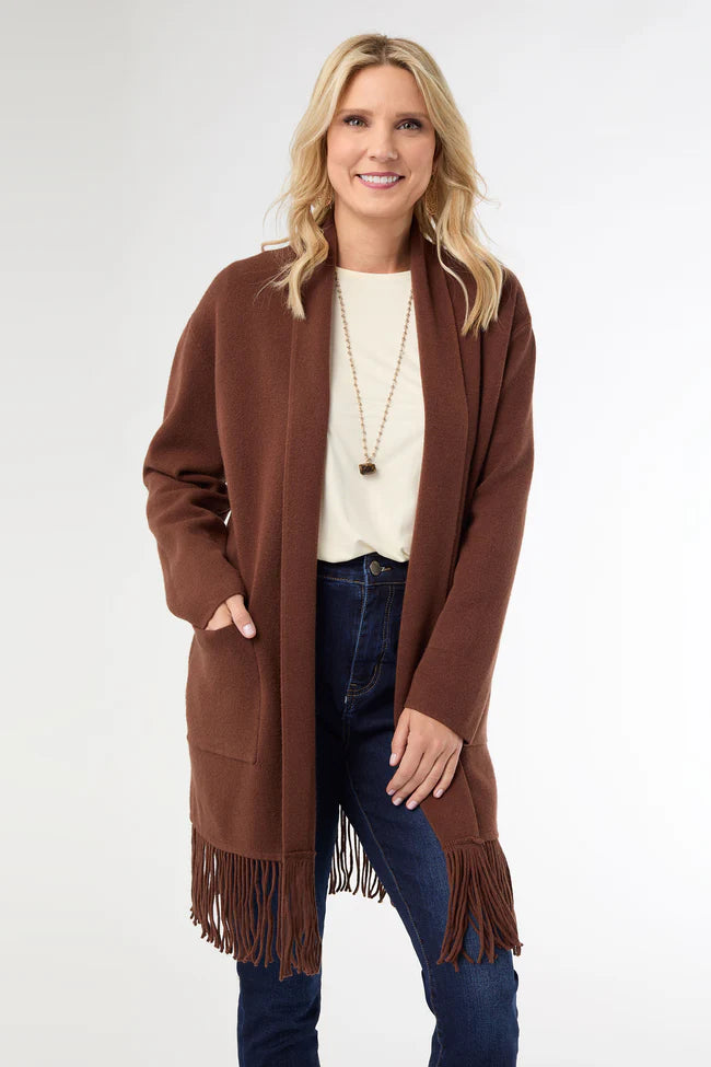 Soft mid-length cardigan with fringe hem, open front, long sleeves, and cozy pockets.