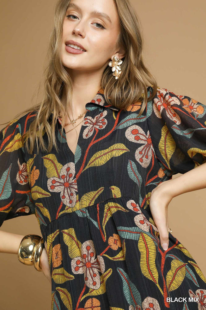 Close-up of v-neckline and floral pattern on Mixed Floral Midi Dress