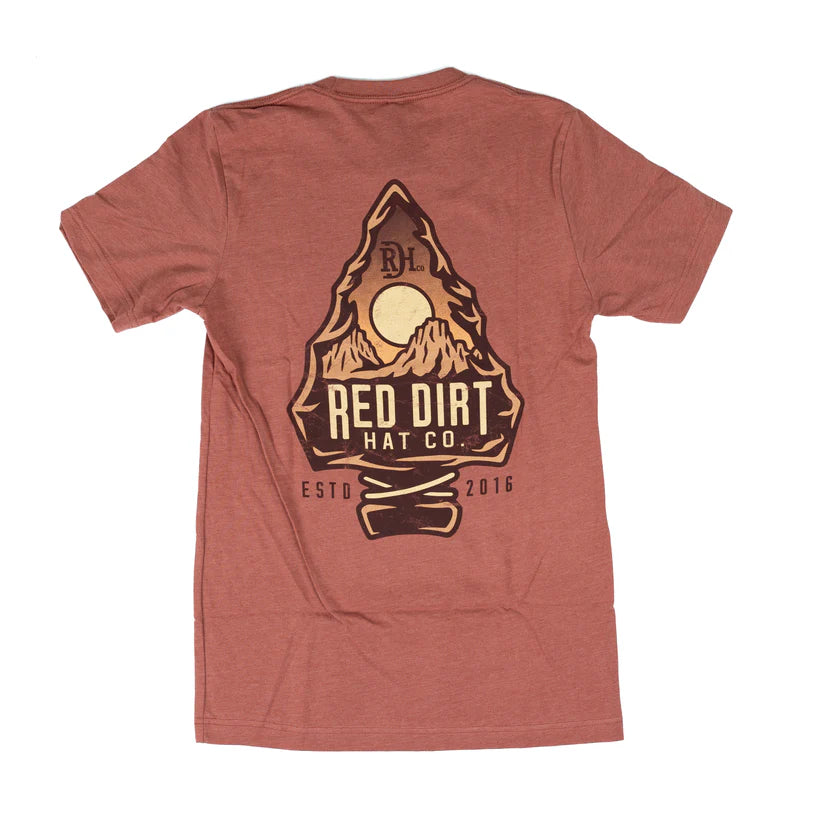 Red Dirt Hat Co. Sunset Peak tee in rust with RDH chest logo and mountain sunset back graphic