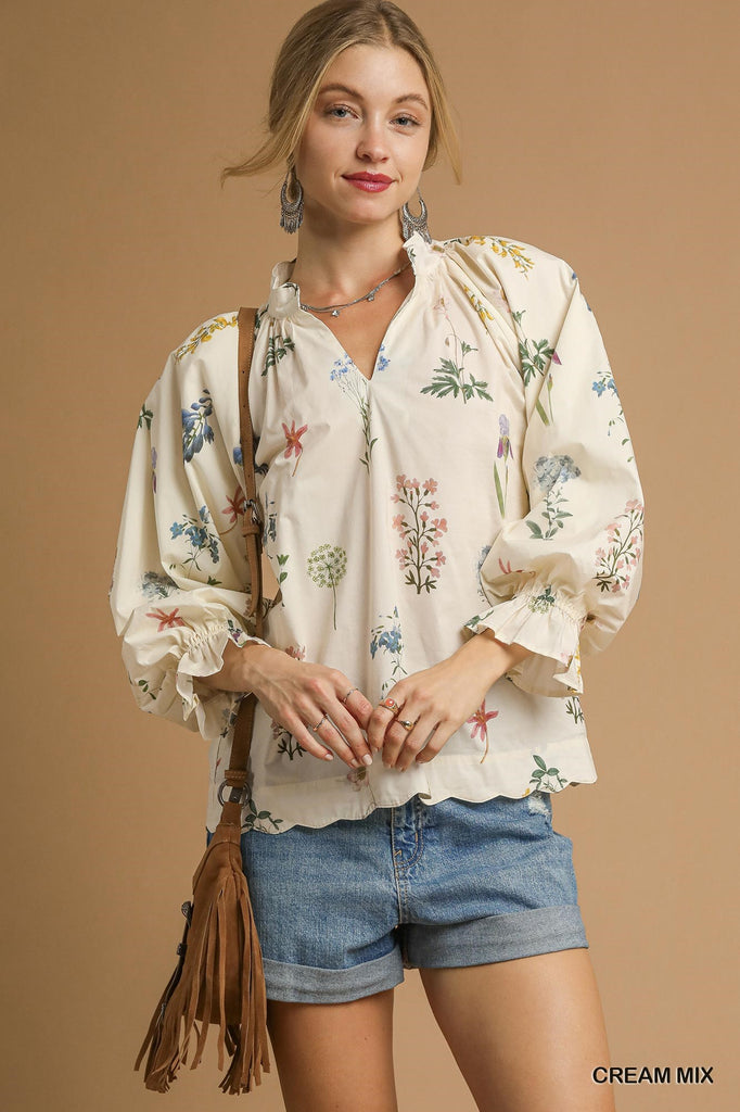 Scalloped hem detail of the Floral Ruffle Neck Blouse