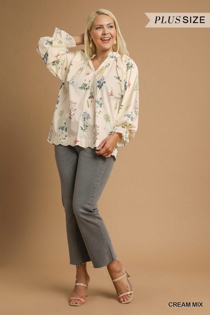 Woman wearing a floral blouse and gray pants on a beige background