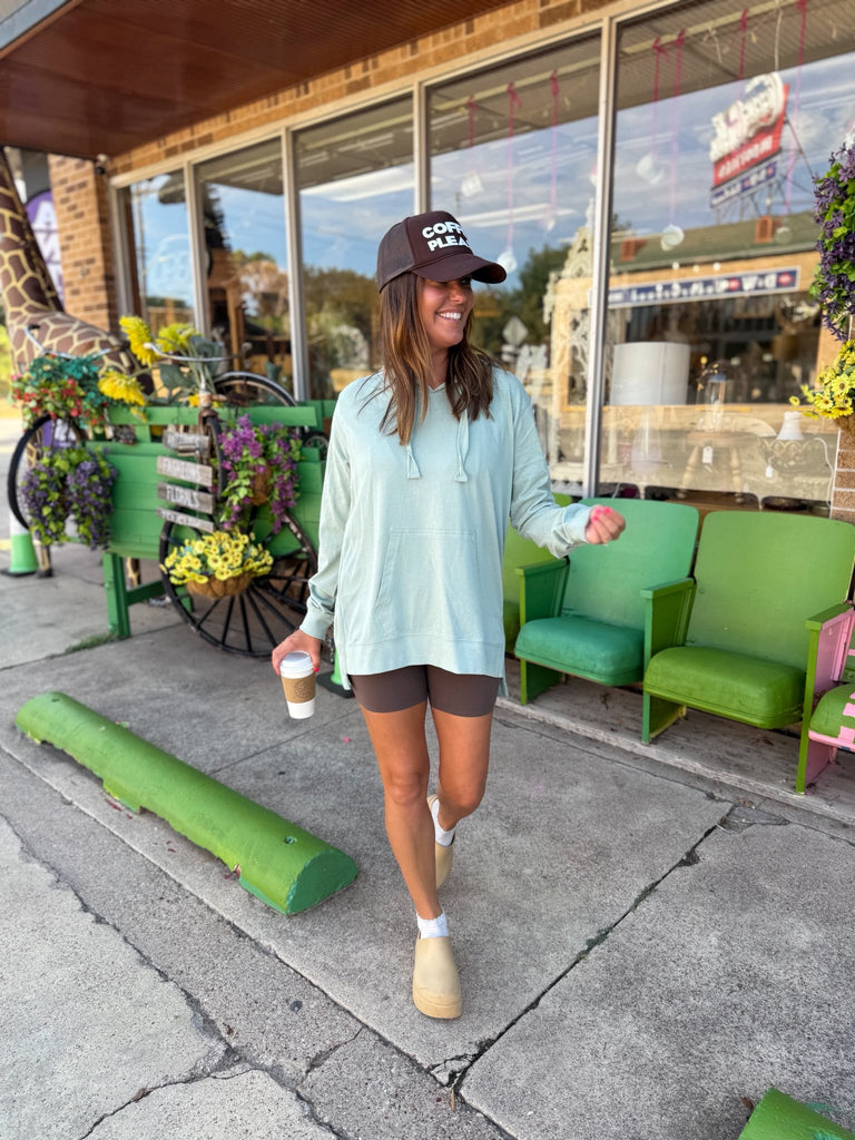 Stone green cotton hoodie with oversized drawstring, trim detail, and pouch pocket.