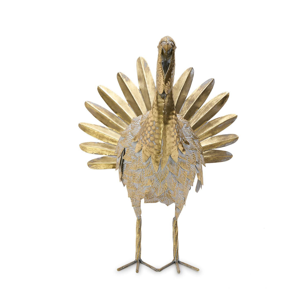 Decorative gold bird sculpture on a white background