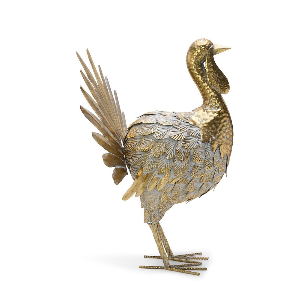 Decorative bird sculpture with gold and silver feathers on a white background