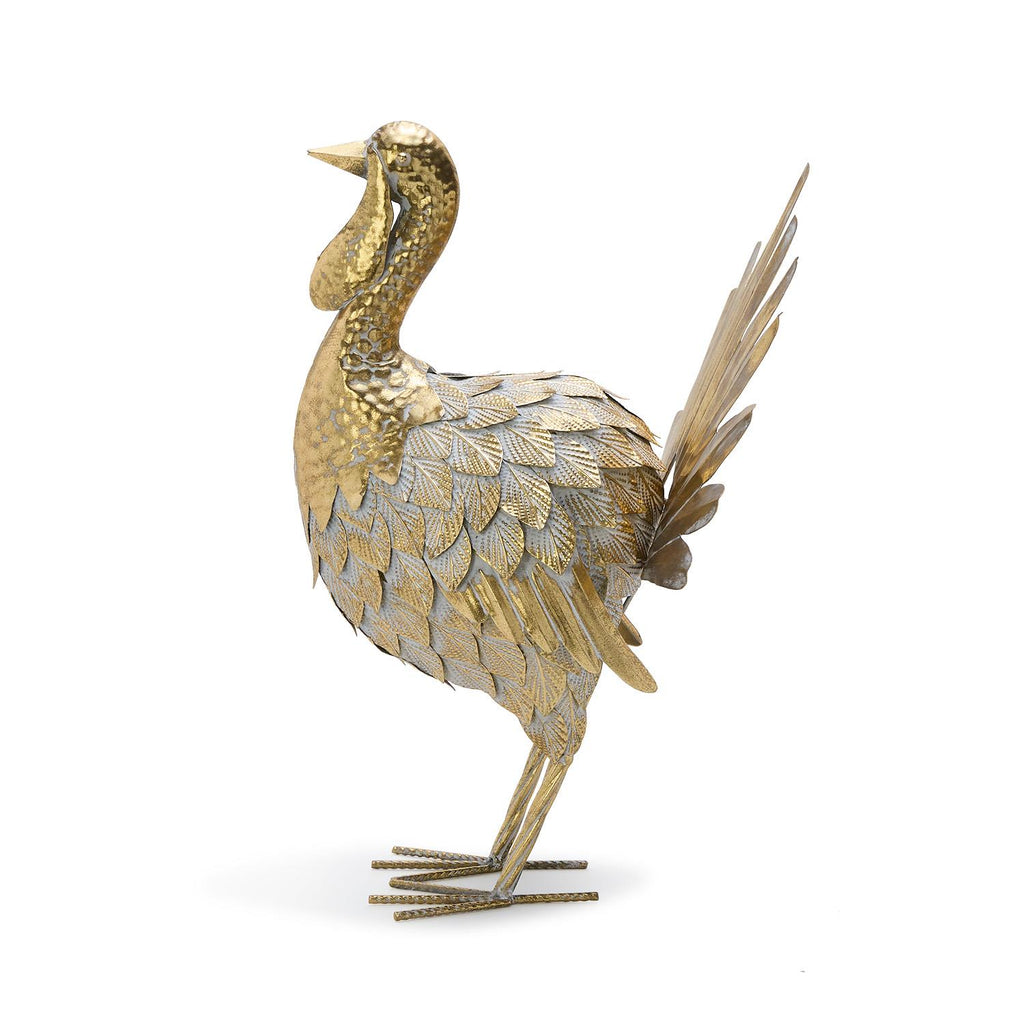 Decorative gold bird sculpture on a white background