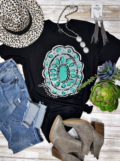 Flat lay of Callie’s Genuine Concho Tee with turquoise concho graphic