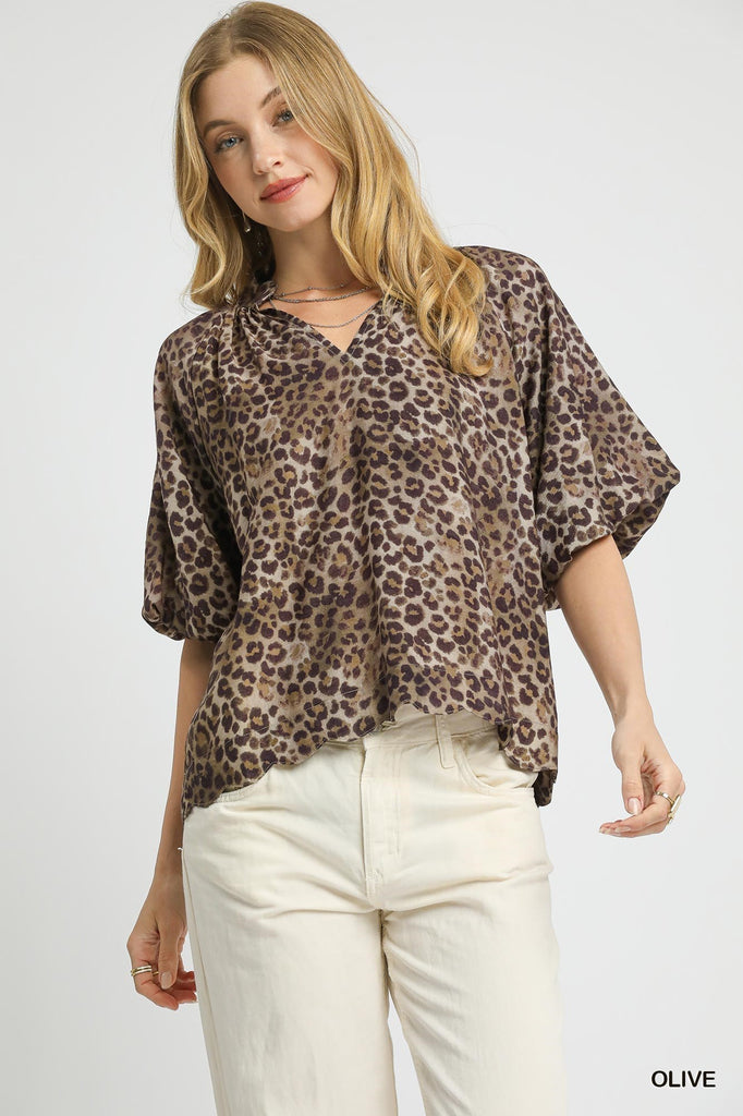 Olive leopard print V-neck top with short bubble sleeves and scalloped hem

