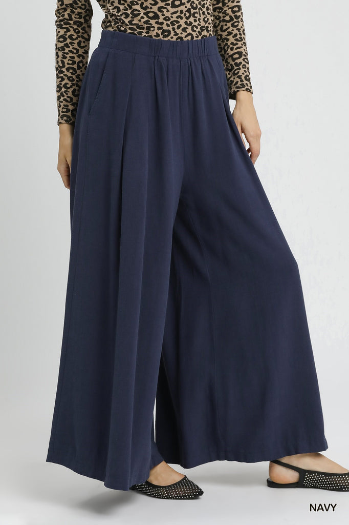 Flowy navy linen blend trousers with elastic waistband and pockets


