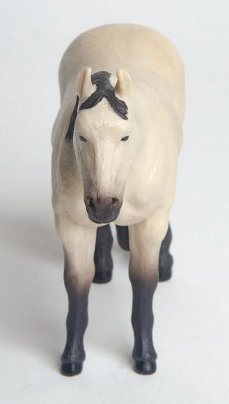 Little Buster Toys buckskin quarter horse toy with black mane, tail, and legs
