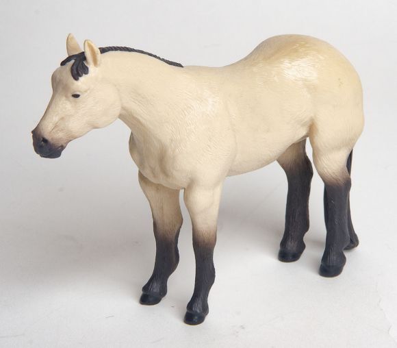 Little Buster Toys buckskin quarter horse toy with black mane, tail, and legs