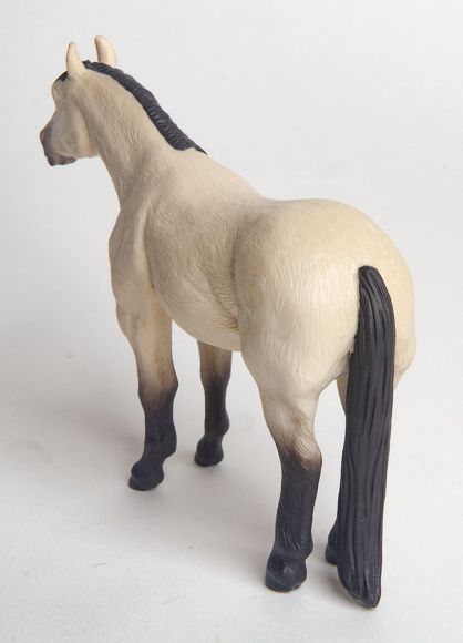 Little Buster Toys buckskin quarter horse toy with black mane, tail, and legs