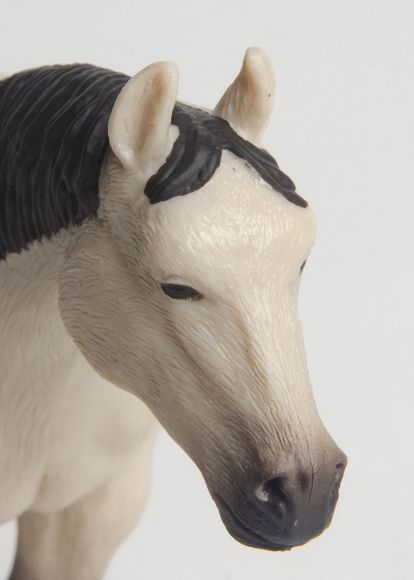 Little Buster Toys buckskin quarter horse toy with black mane, tail, and legs