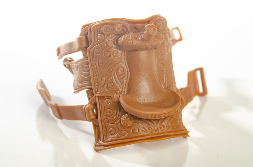 Little Buster Toys calf roping saddle with realistic tooling and stirrup details