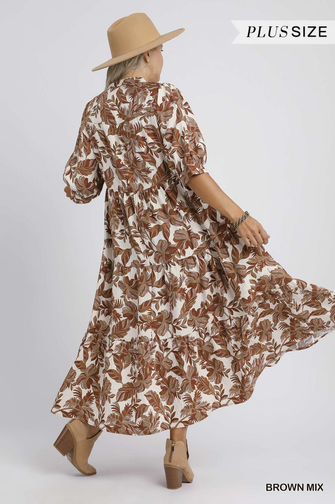 Woman wearing a brown and white floral dress with a beige hat on a white background